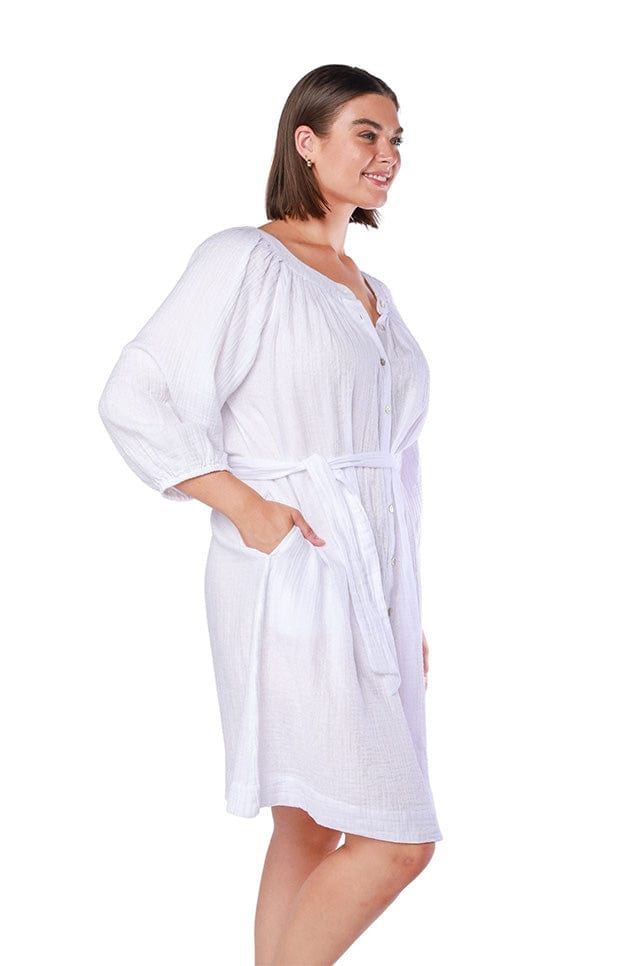model wearing white cheesecloth button through beach dress