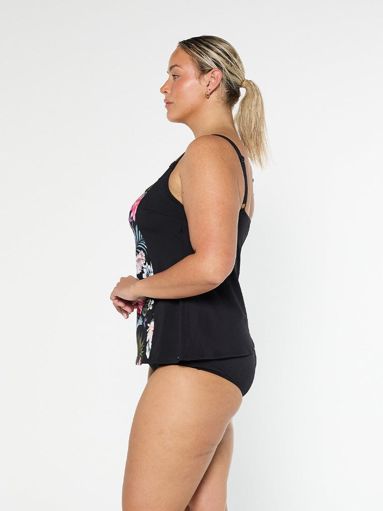 Blonde model showing the side of black tankini top in chlorine resistant fabric