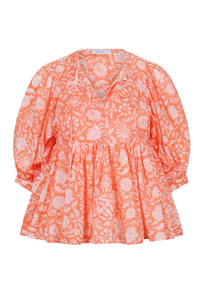 ghost mannequin of a peach and white block printed top with puffy sleeves