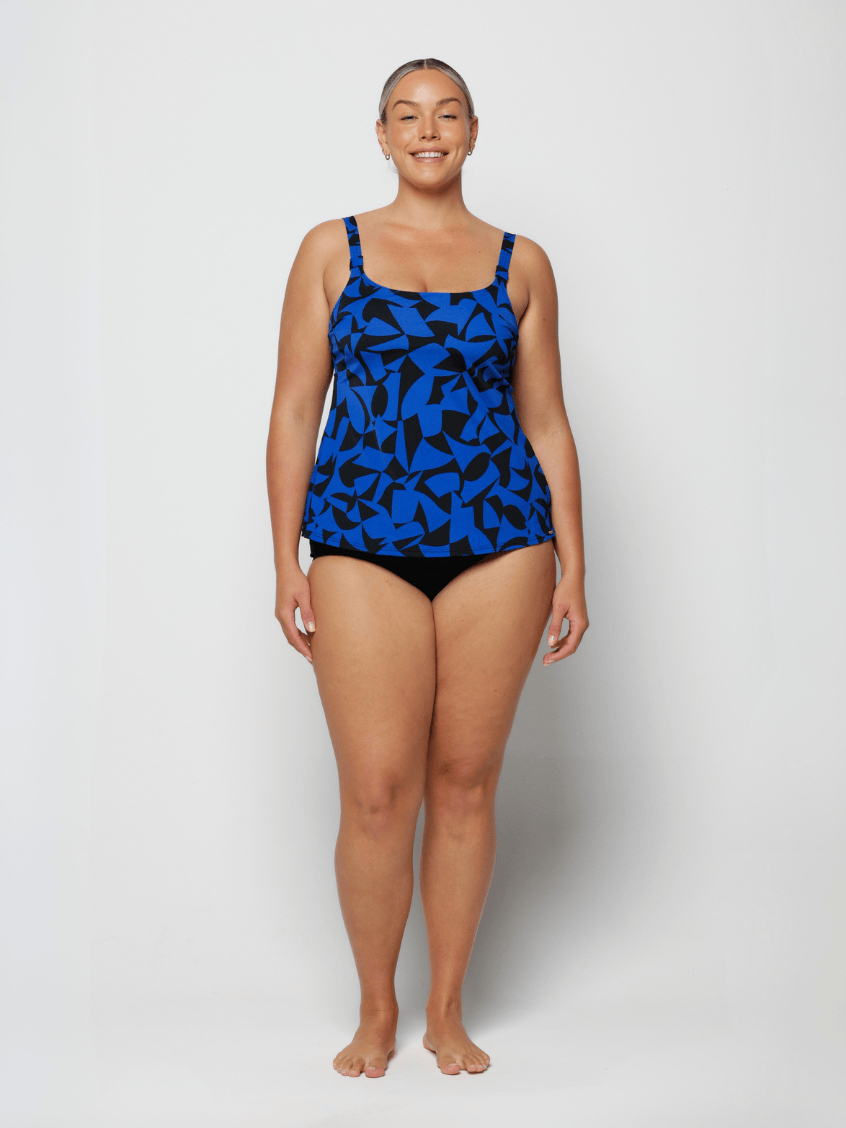 Woman wearing a blue camouflage swimsuit on a white background