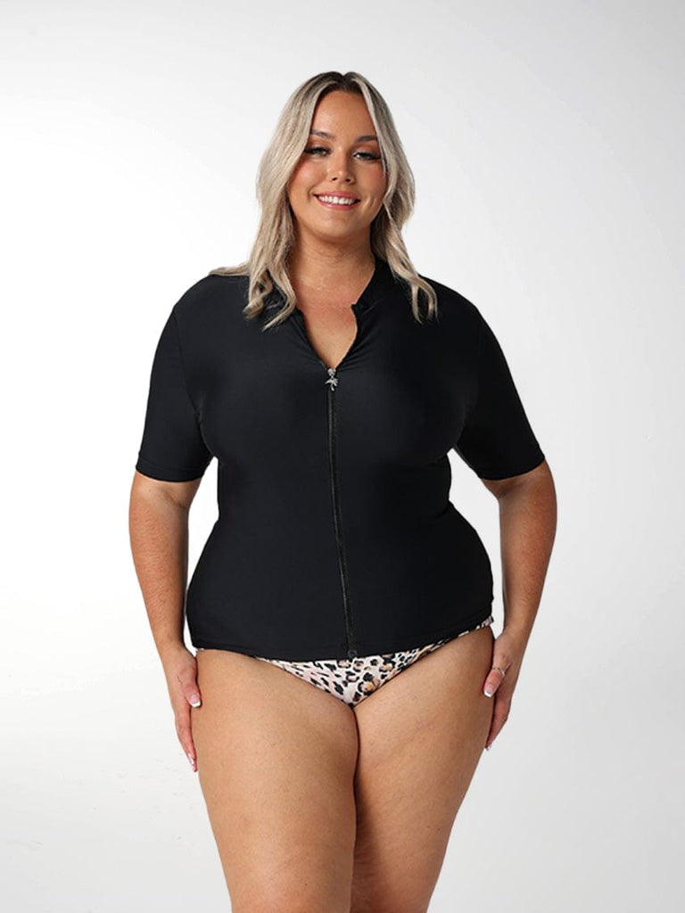 Blonde model wearing short sleeve rash vest with zip detail