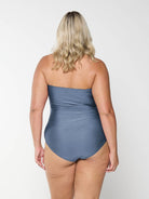 model showing back of shiny grey swimsuit