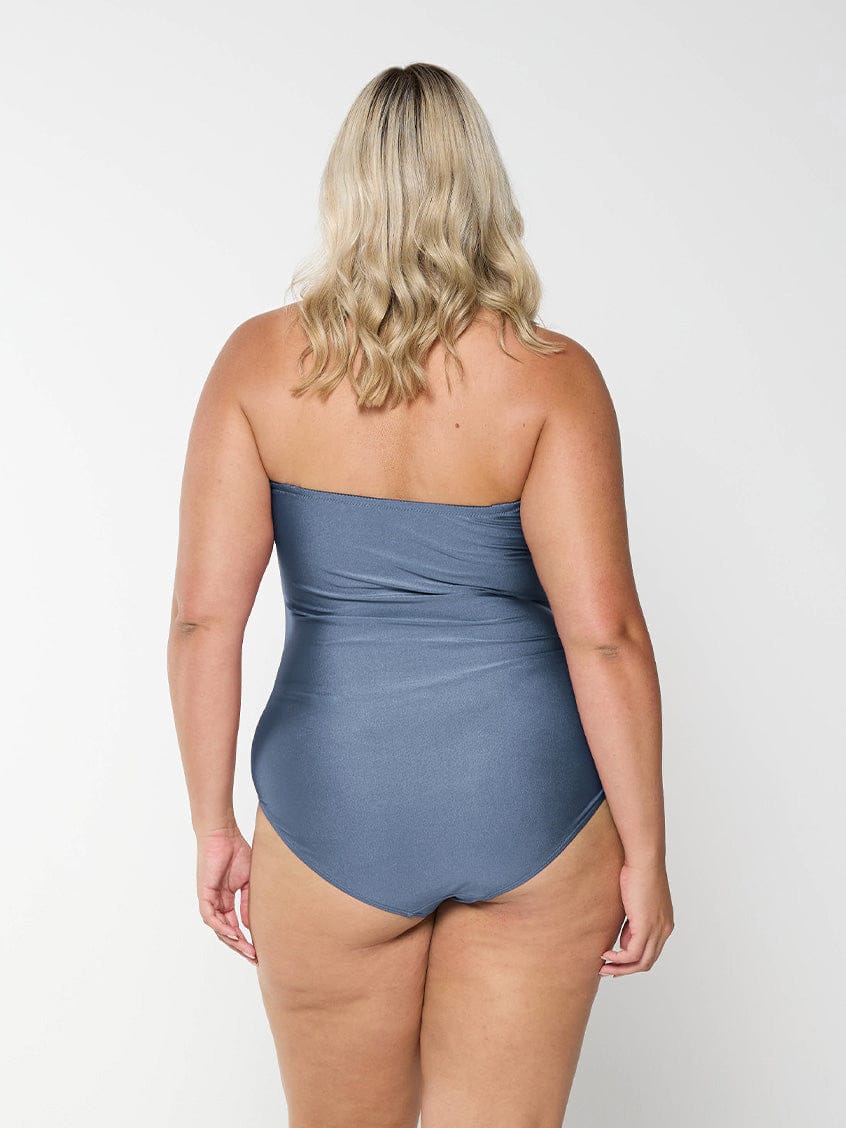 model showing back of shiny grey swimsuit