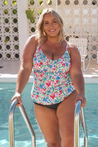 Blonde model wears bright floral underwire tankini top swimwear