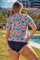 Model showing back of floral short sleeve rash vest