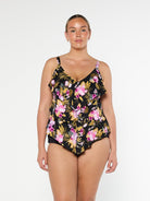 Blonde model wears stunning black and pink floral 3 tier tankini top in chlorine resistant fabric