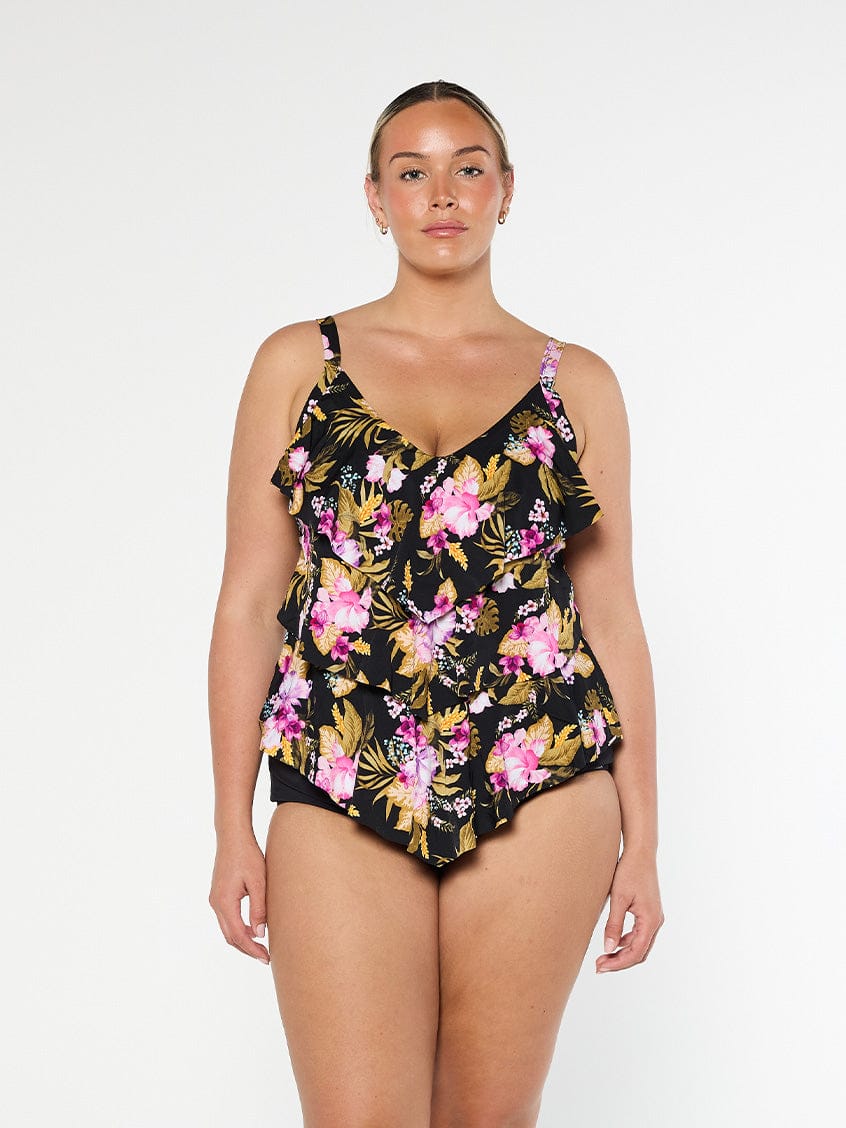 Blonde model wears stunning black and pink floral 3 tier tankini top in chlorine resistant fabric