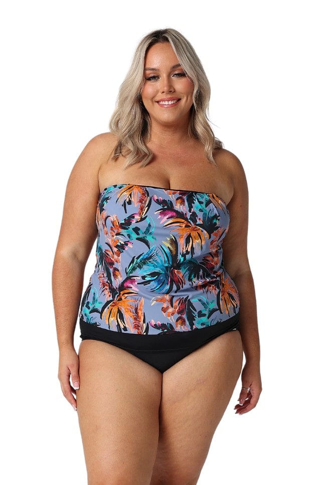Model wearing blue tropical print flouncy swim tankini