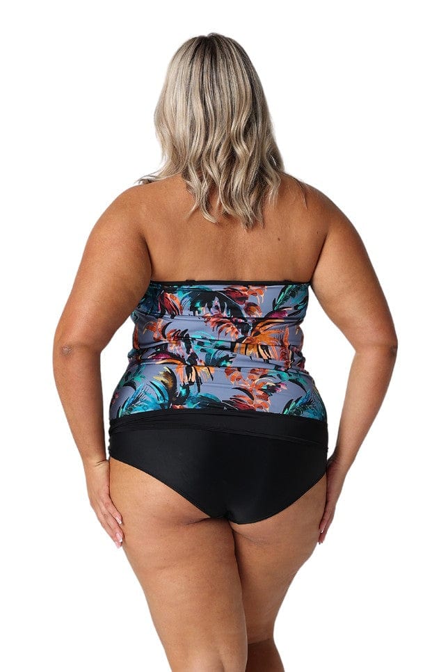 Model wearing faded blue tropical print womens swim tankini