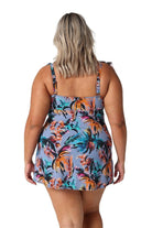 Model showing back of blue tropical print womens swim dress
