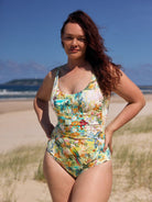 Woman wearing a colorful swimsuit on a beach