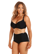 Woman wearing a black bra and high-waisted underwear on a white background