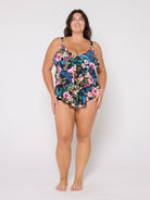 Woman wearing a floral swimsuit on a white background