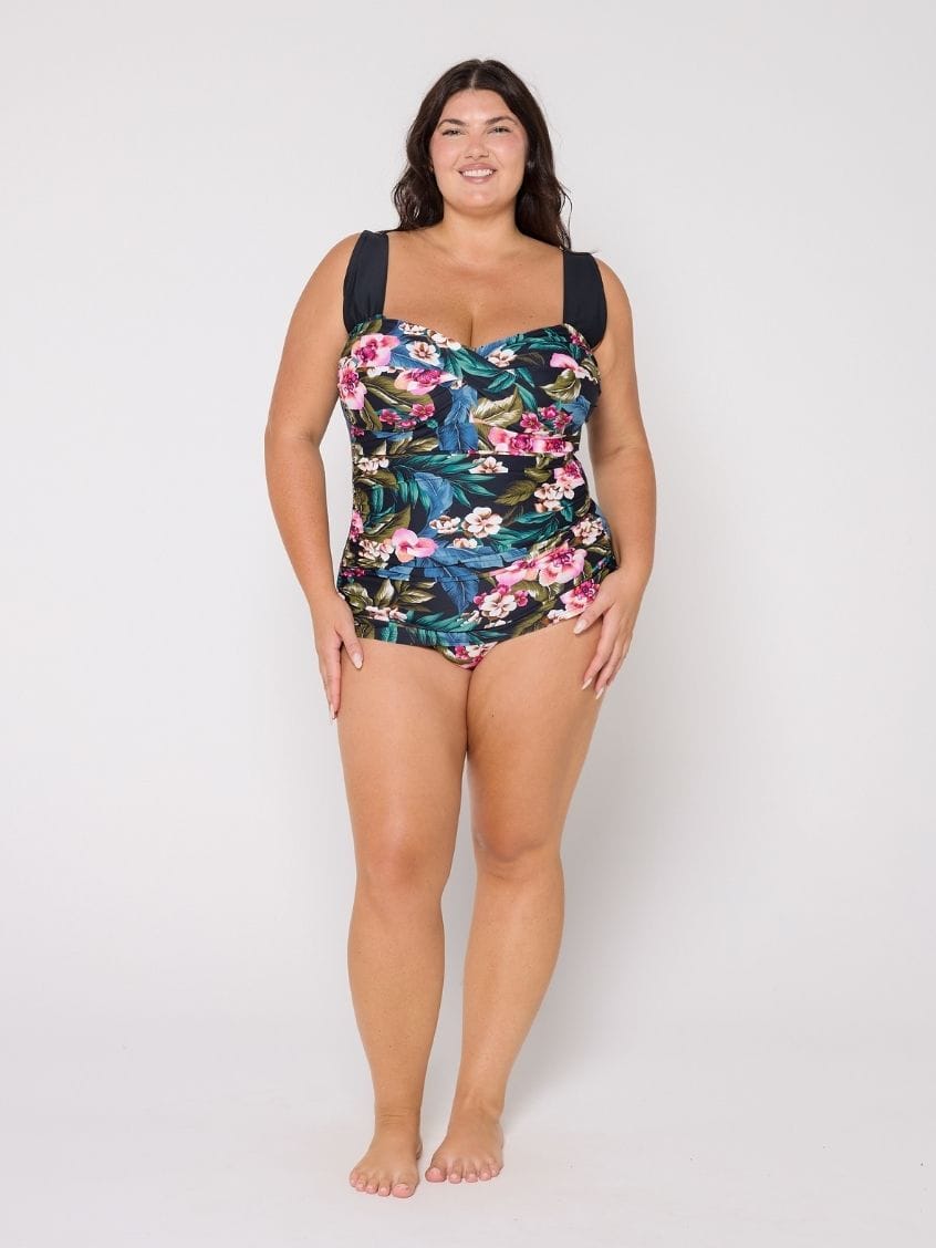 Woman wearing a retro floral swimsuit in the studio