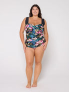 Woman wearing a retro floral swimsuit in the studio