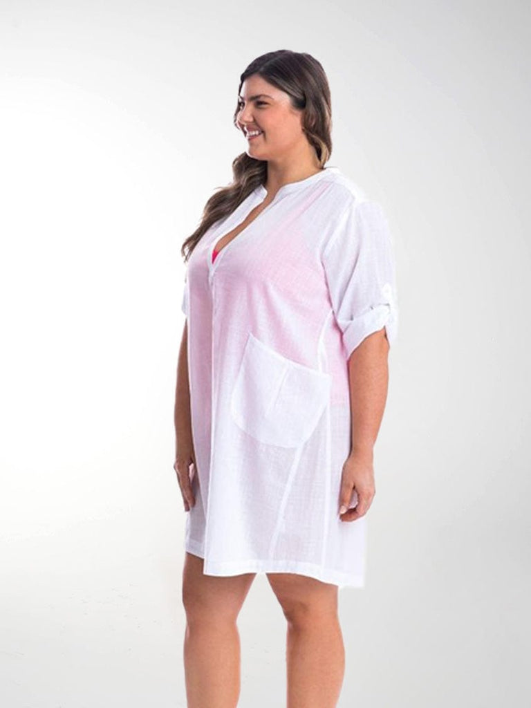 Side profile of model wearing dress with rolled up sleeves