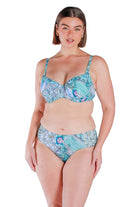 model wearing a blue and white tile printed mid hip bikini pant