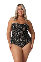 Model wearing black floral strapless bandeau one piece