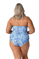 Model showing back of blue floral strapless swimsuit