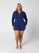 Woman wearing a blue swimsuit set on a white background