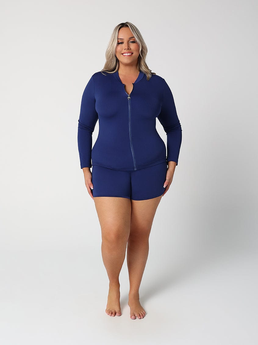 Woman wearing a blue swimsuit set on a white background