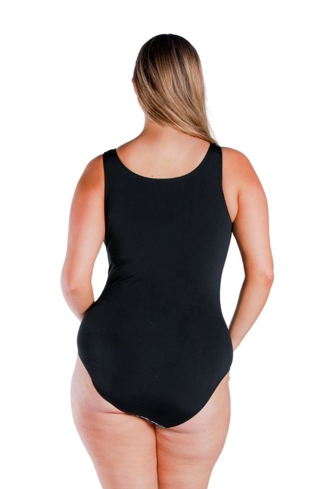 back profile of size 16 woman wearing a black sleeveless chlorine resistant one piece swimsuit