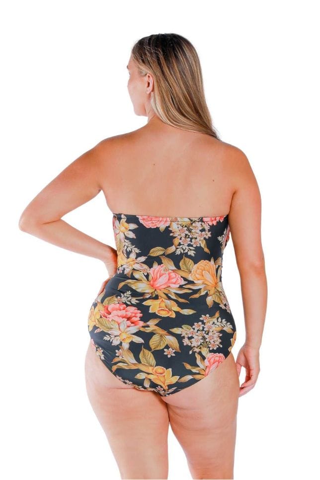 Model wearing orange and yellow floral and black printed twist front bandeau one piece