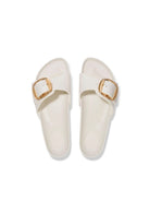 A pair of off-white slide sandals with double straps and gold-tone square buckles, shown from a top-down view on a white background.