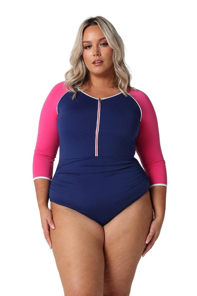 Model wearing navy and pink cropped sleeve one piece