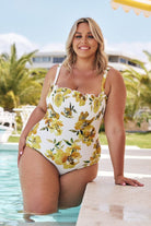 Blonde model wears flattering yellow strapless bandeau one piece with removable straps