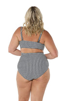 model showing back of black and white swim pant