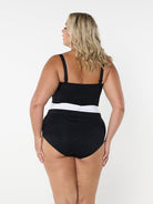 model showing back of black and white textured swimsuit