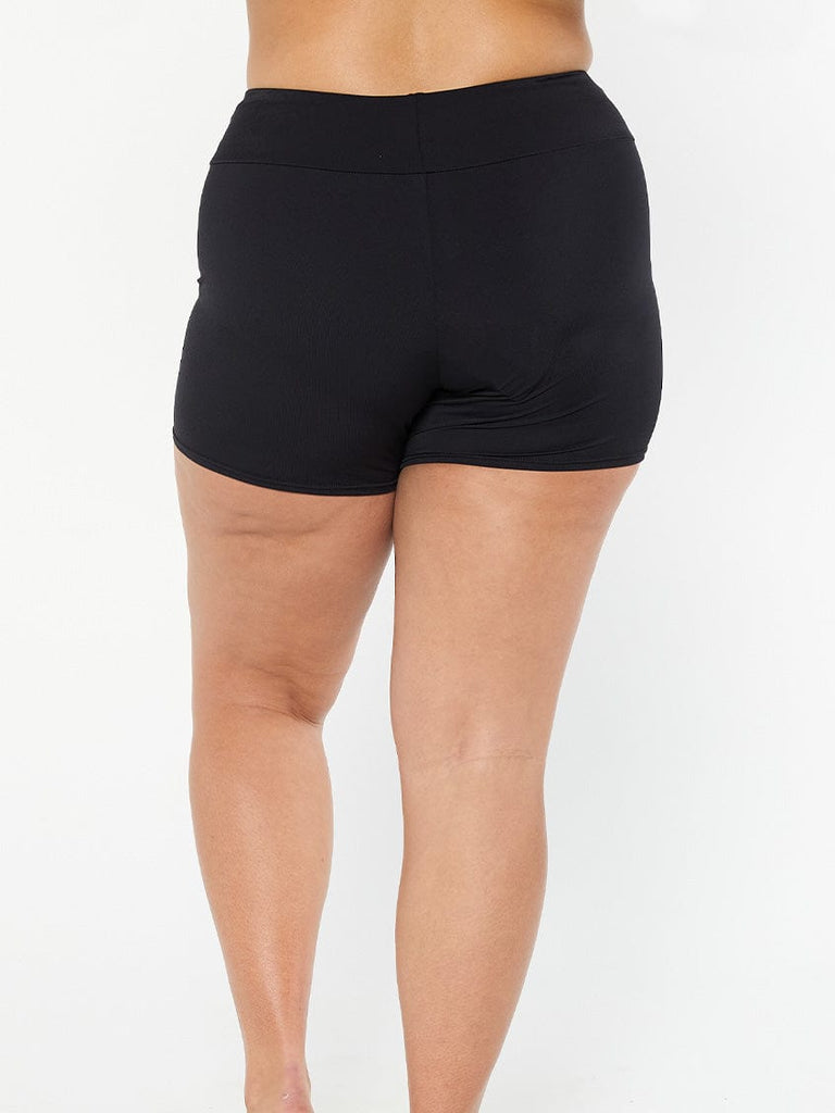 model showing back of black boyleg style swim short