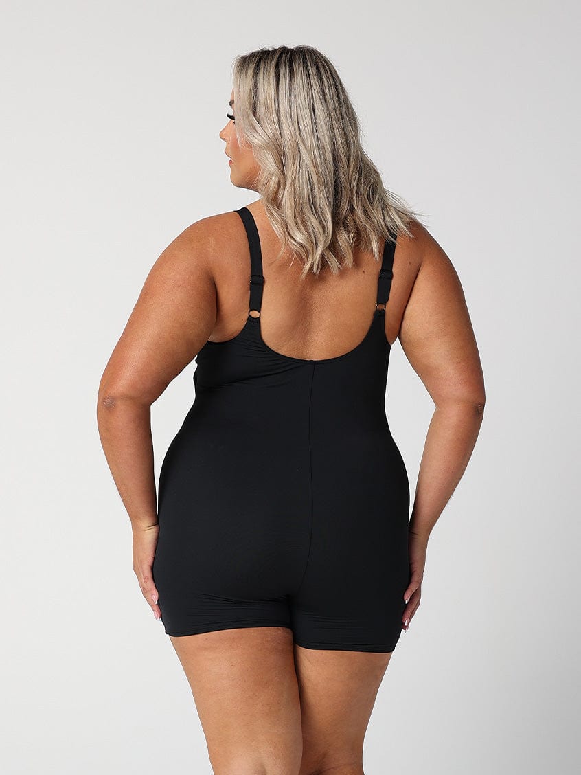 model showing back of black boyleg one piece