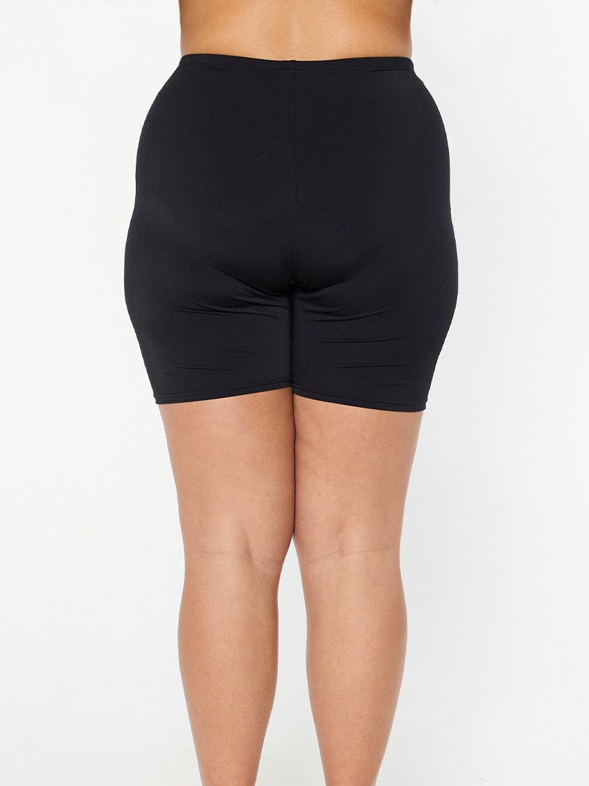 model showing back of black chlorine resistant black bike pant