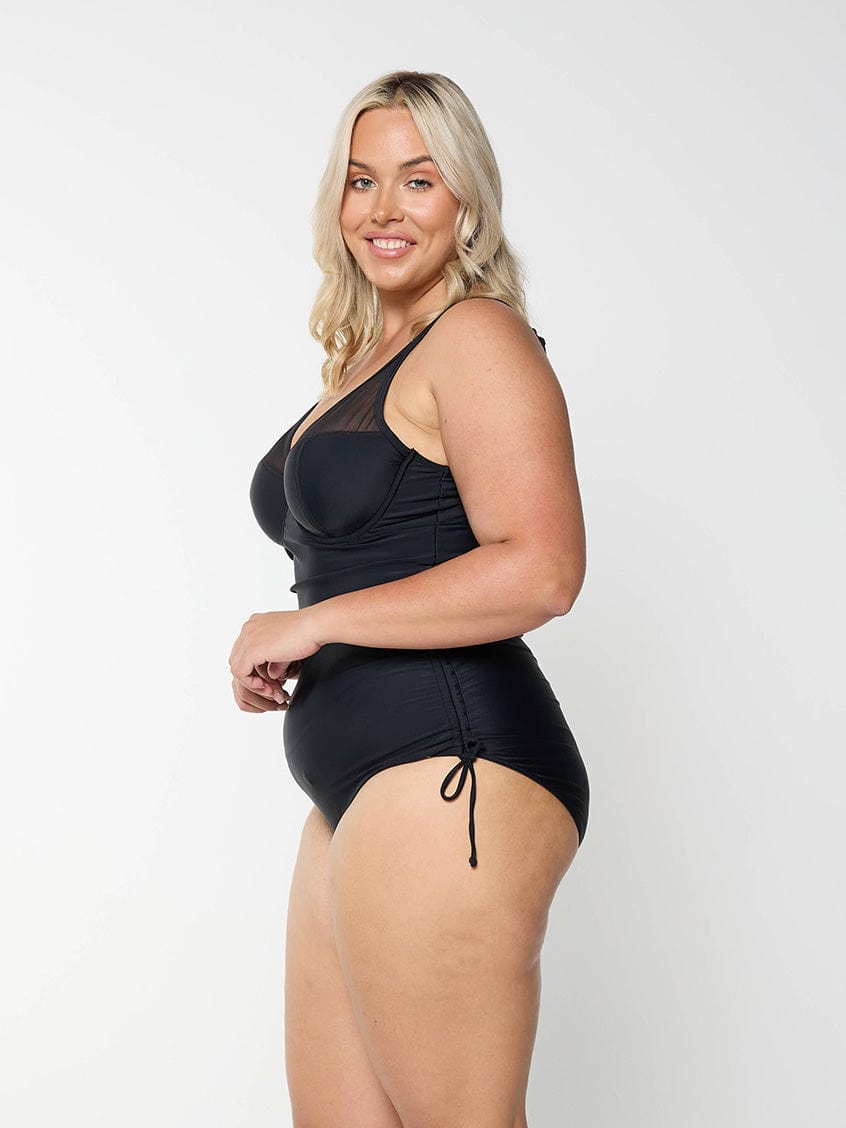 model wearing black mesh one piece swimsuit