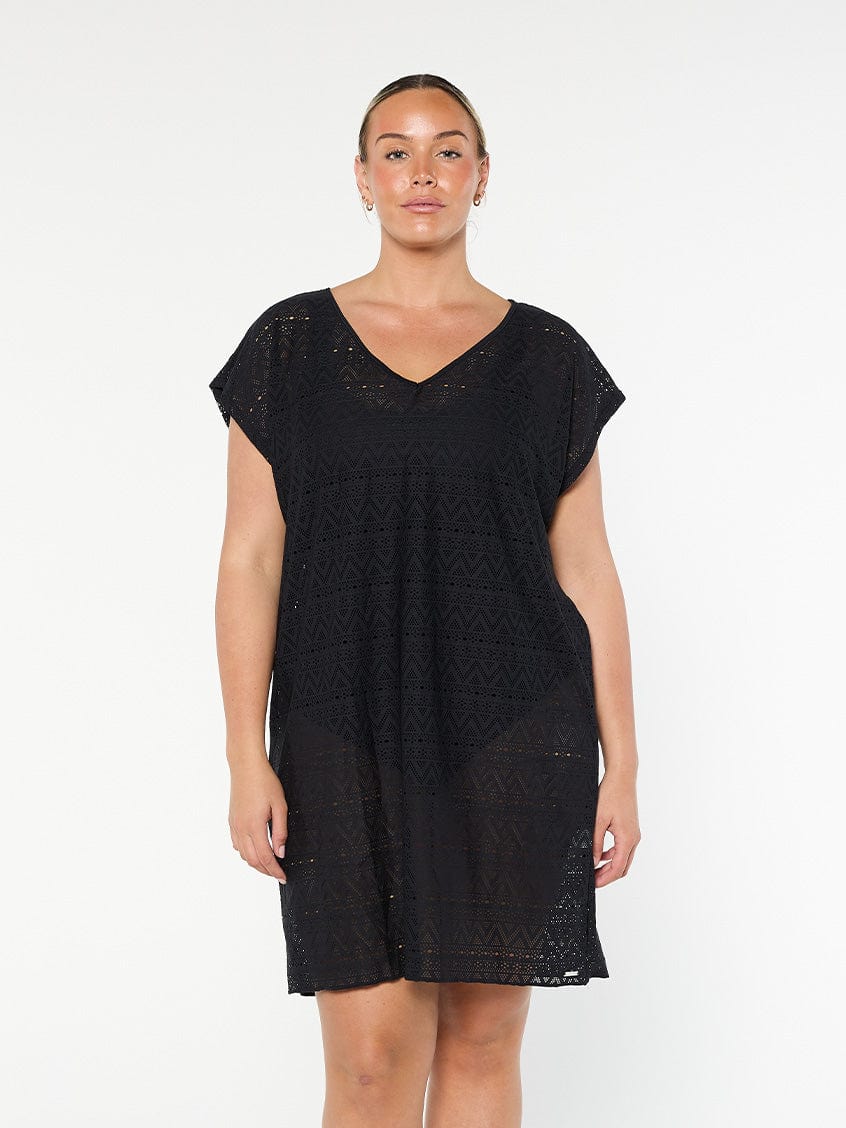 model wearing black mesh beach cover up