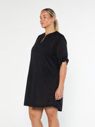 model wearing black over shirt cover up