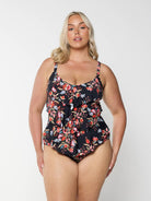 model wearing black and red floral women's one piece swimsuit