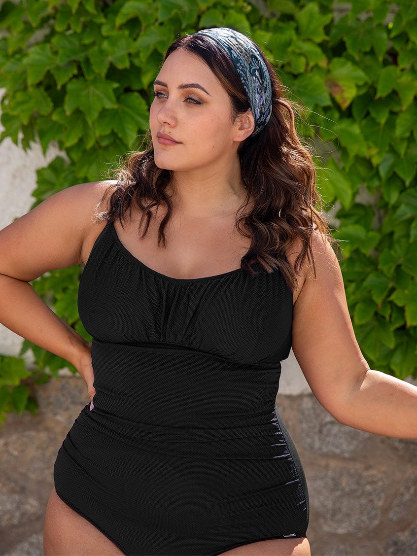 model wearing black textured women's swimsuit