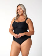 model showing side of black twist bandeau one piece