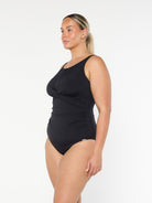 model showing side of black high neck swimsuit