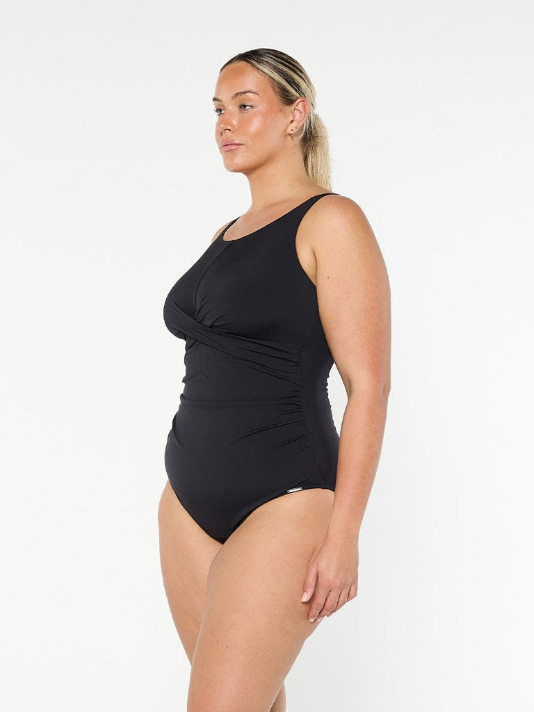 model showing side of black high neck swimsuit