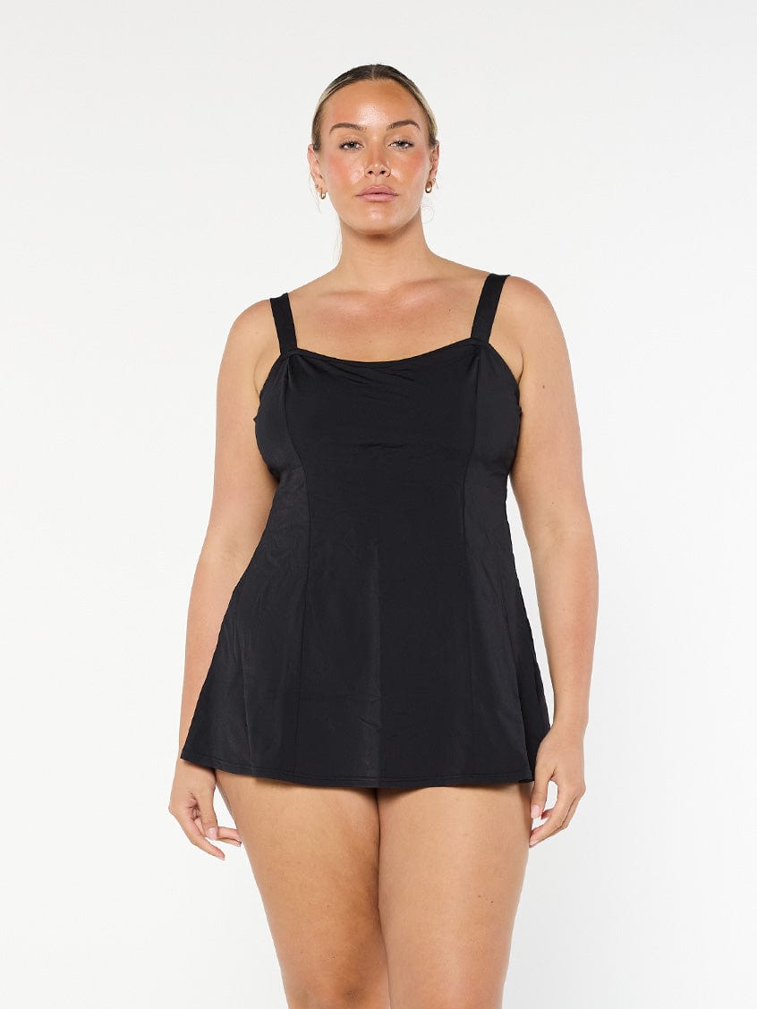 model wearing black chlorine resistant swim dress