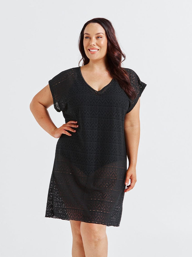 Model in studio wearing a short sleeve mid length coverup beach dress