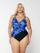 model wearing blue floral waist tie one piece