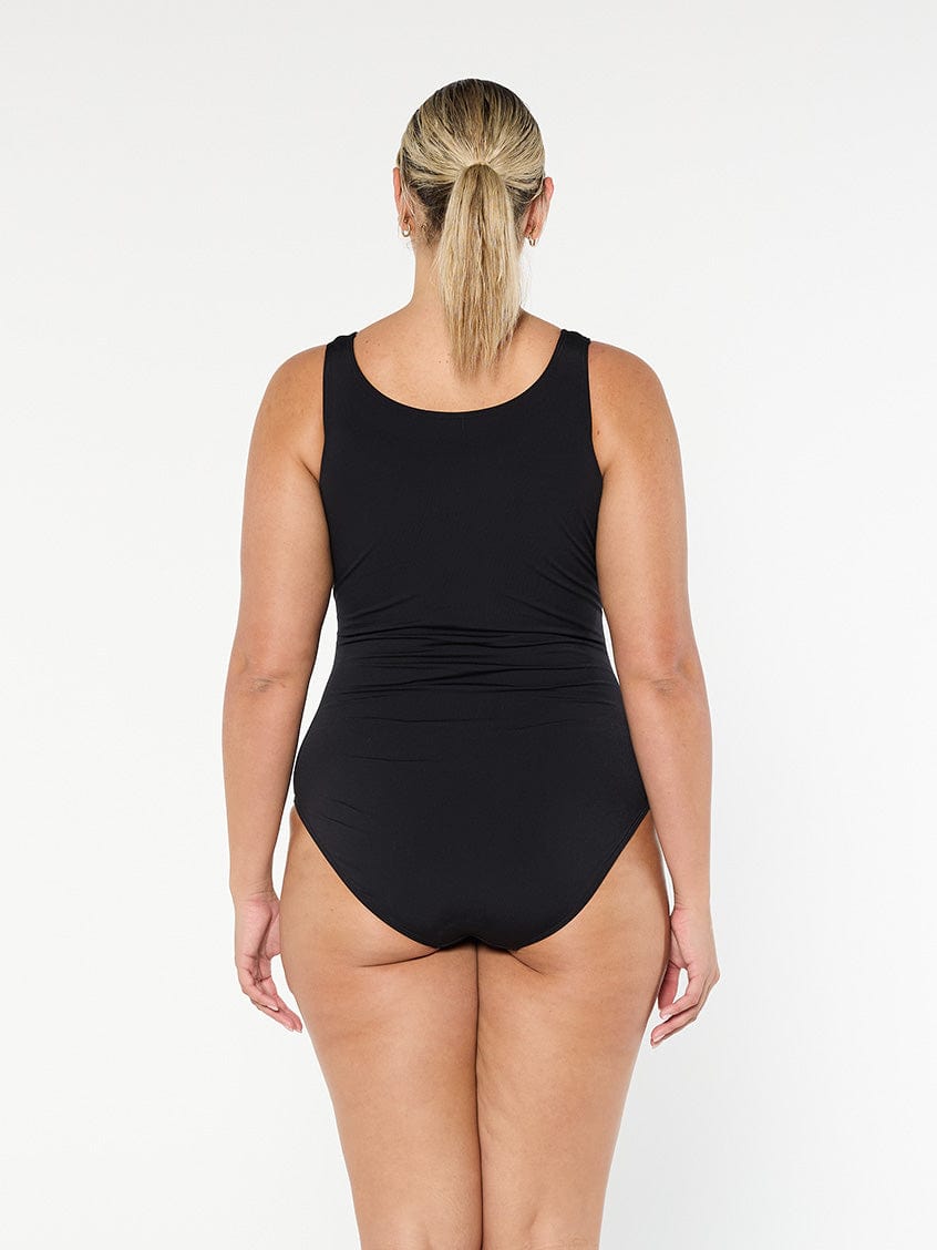 model showing back of black sleeveless women's one piece