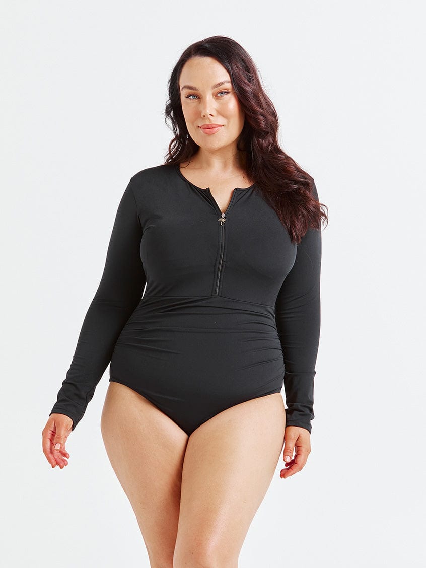 model wearing black long sleeve one piece