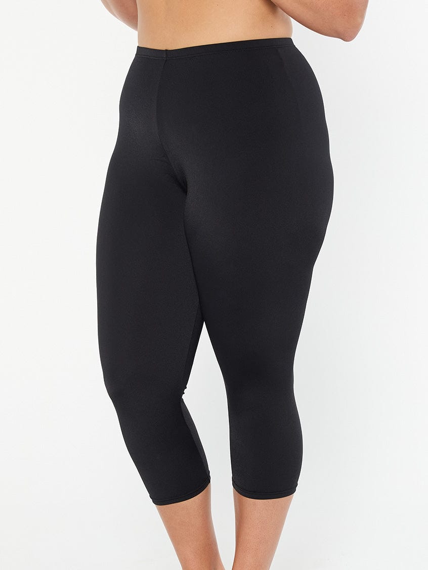 model showing side of black swim pant