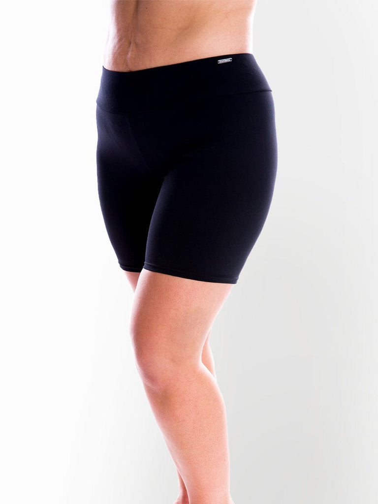 Side profile of model in studio wearing chlorine resistant swim pant